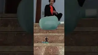 Glass bottle drop on surfer toy #satisfying #transition #asmr #surf